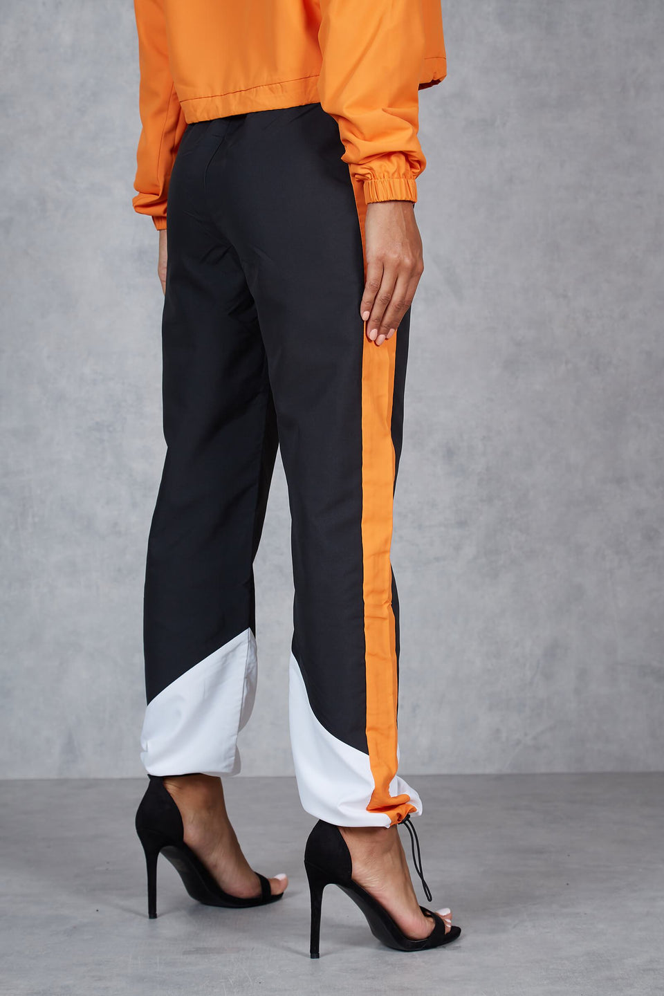 Aspen Shell Track Pants - Orange/Black/White